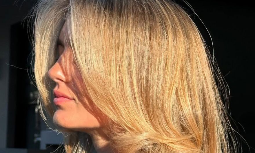 side view of woman with golden blonde hair