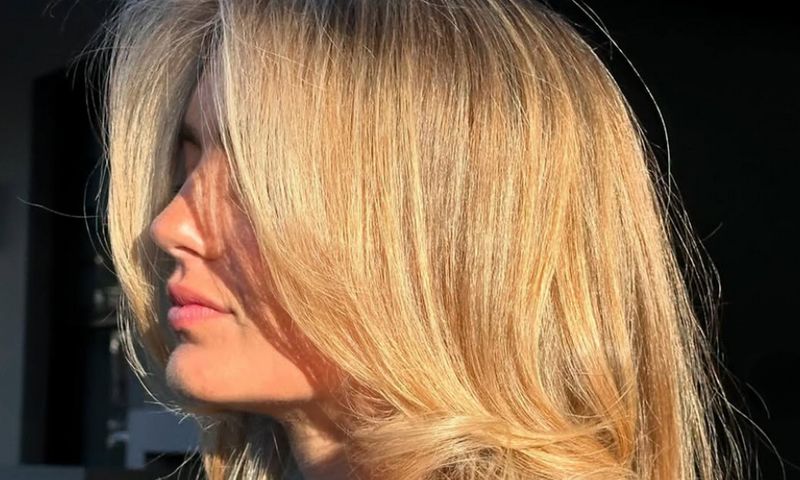 side view of woman with golden blonde hair