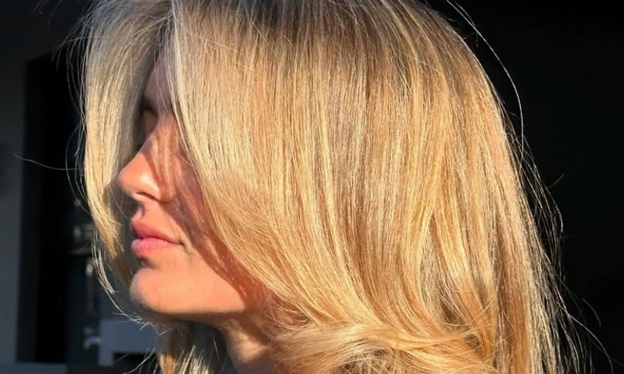 side view of woman with golden blonde hair