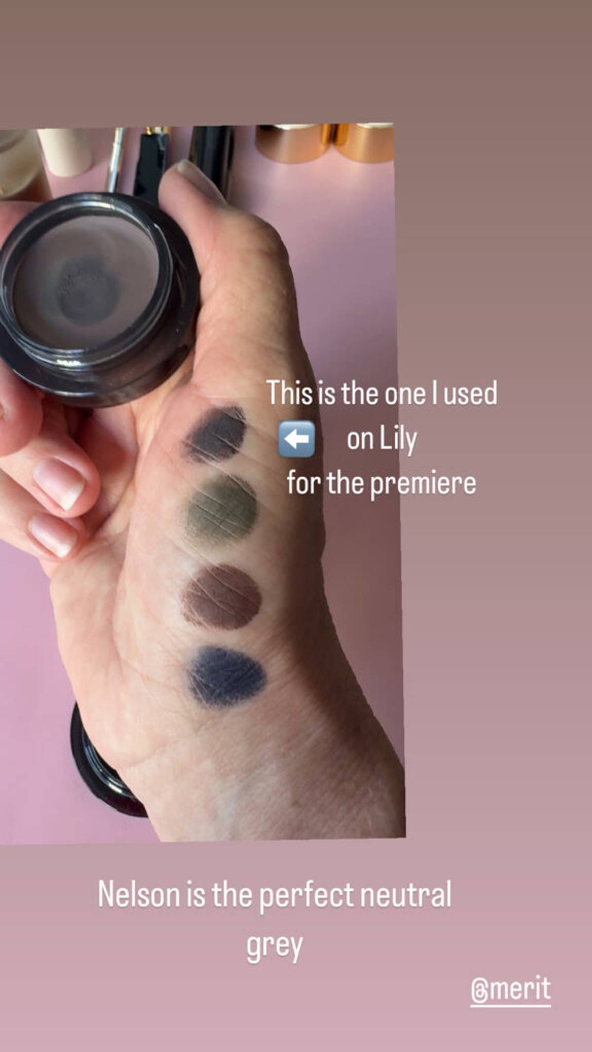 hand holding merit beauty solo shadow with color swatches on hand