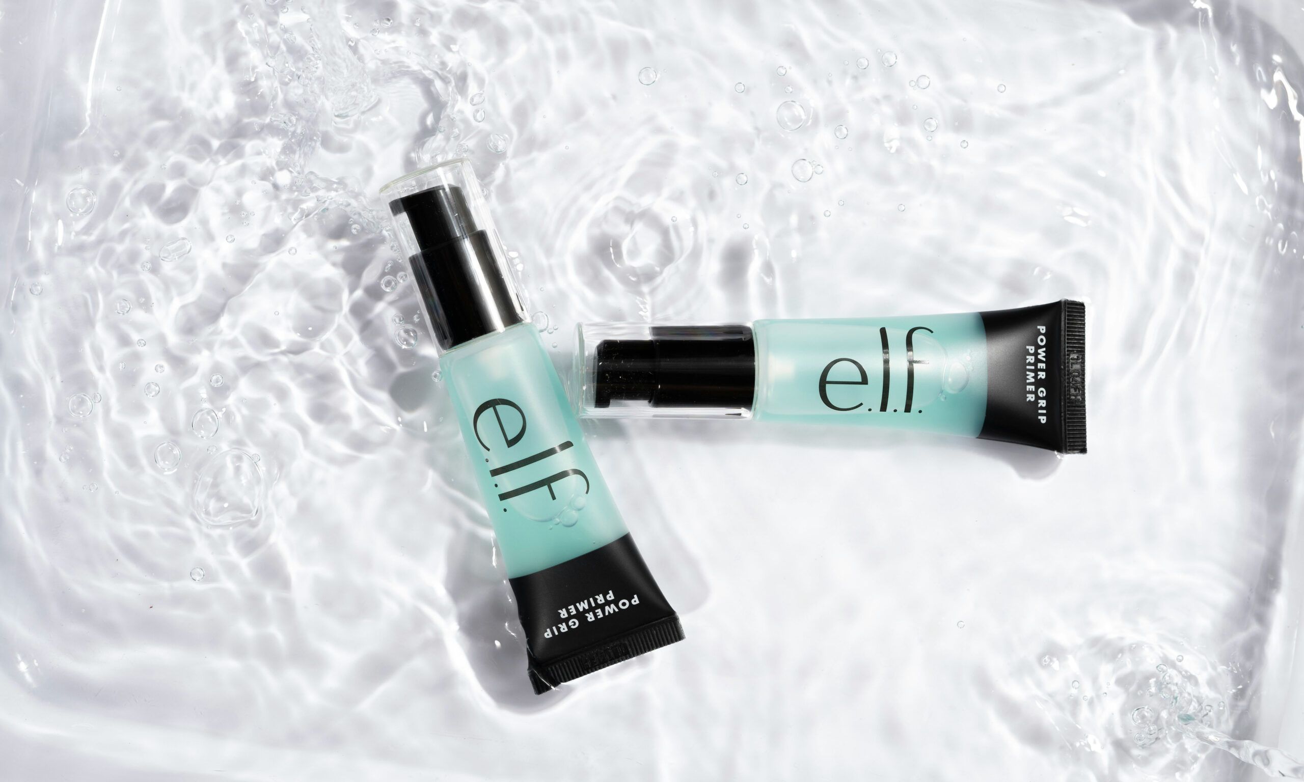 elf cosmetics on water background