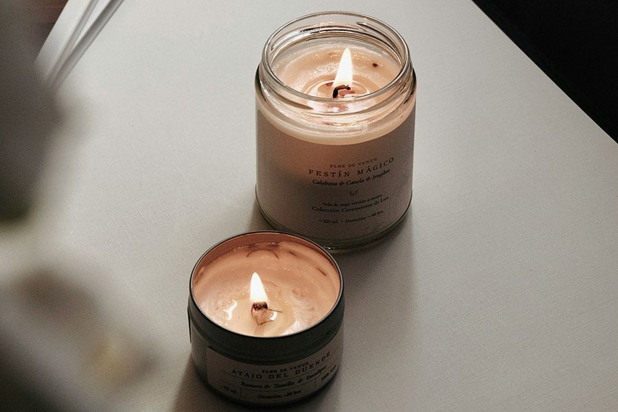 two candles lit on table