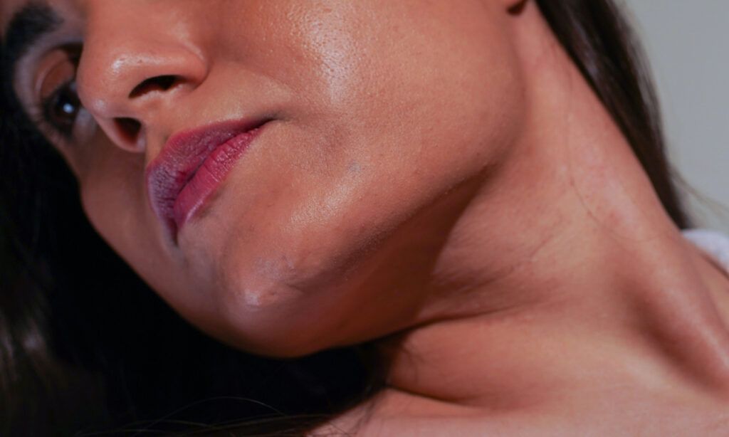 zoomed in photo of woman's jawline