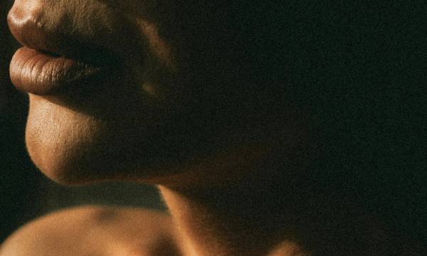 zoomed-in photo of woman's neck and jawline