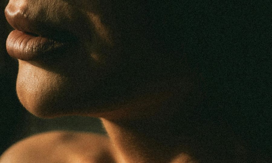 zoomed-in photo of woman's neck and jawline
