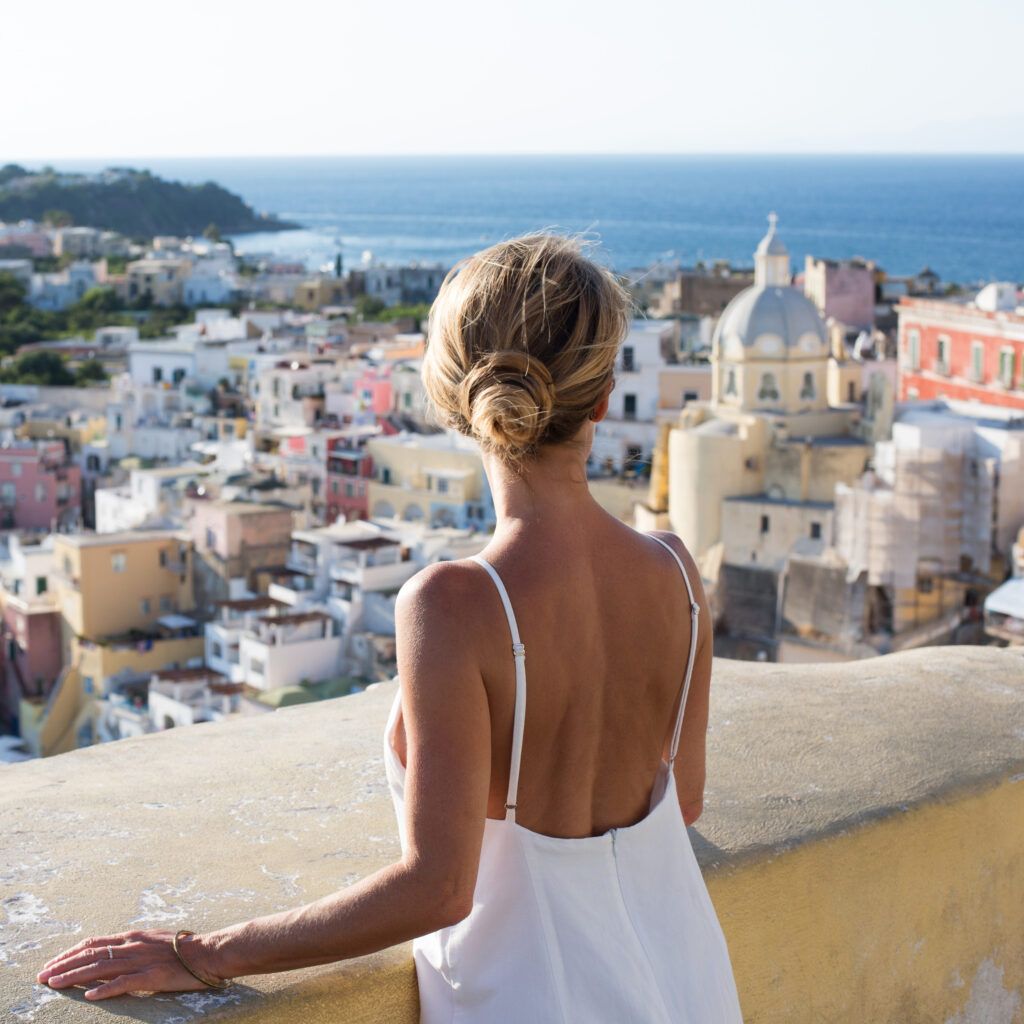 back view of woman standing in european city
