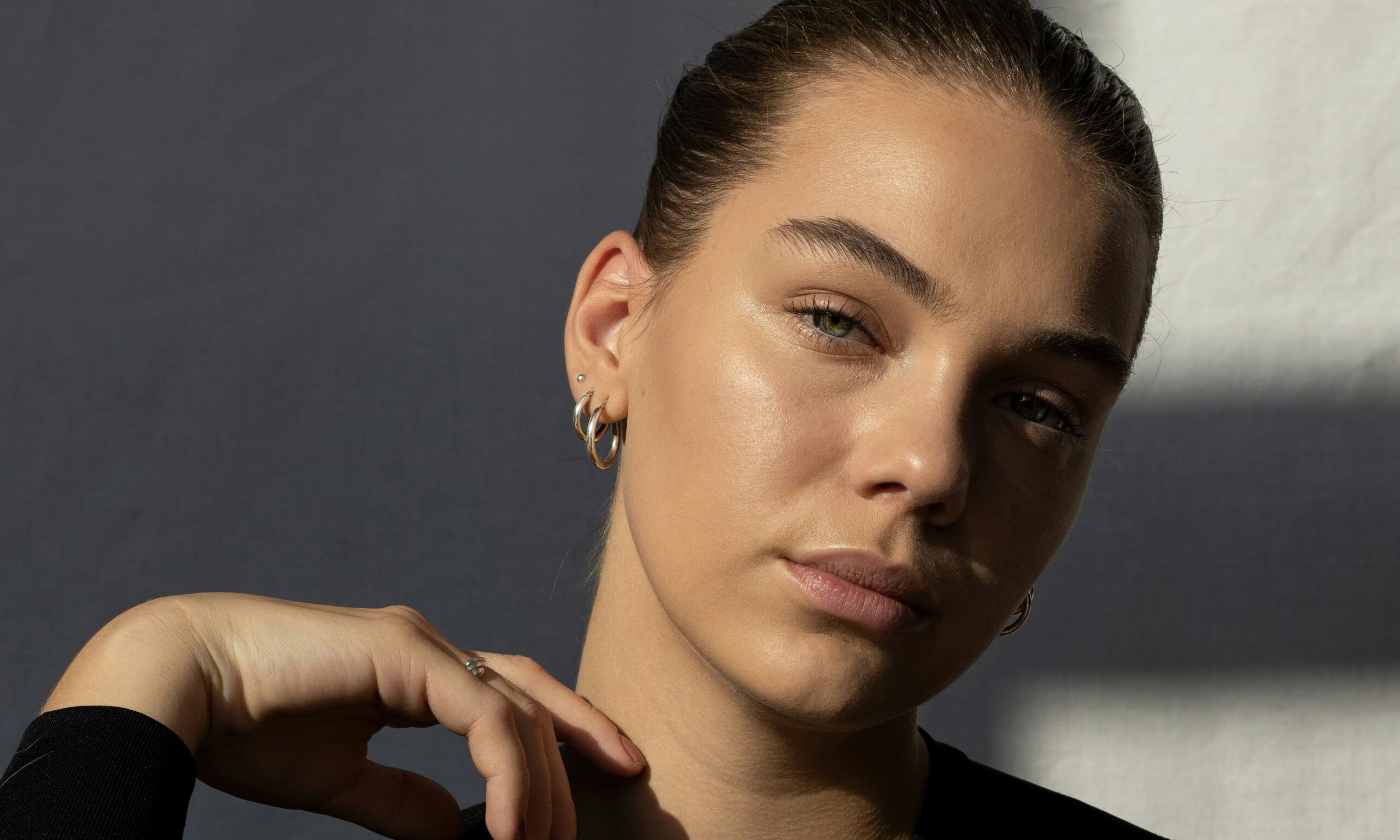 Portrait of woman with shadows in the background