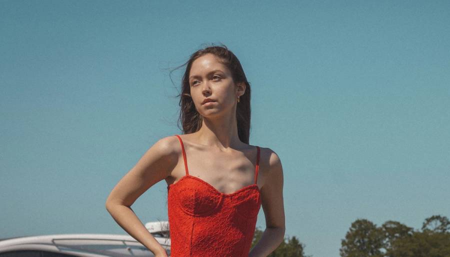 Woman in a bathing suit outside on a dock