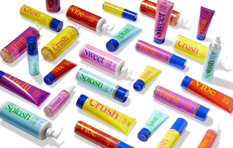 Colorful lineup of Old Navy Beauty Co. products in five scents: Crush, Vibe, Sweet, Thrill and Splash, including body washes, lotions, and hair and body mists in yellow, red, pink, purple and blue packaging.