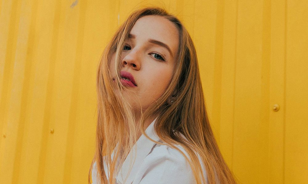 woman portrait against yellow background