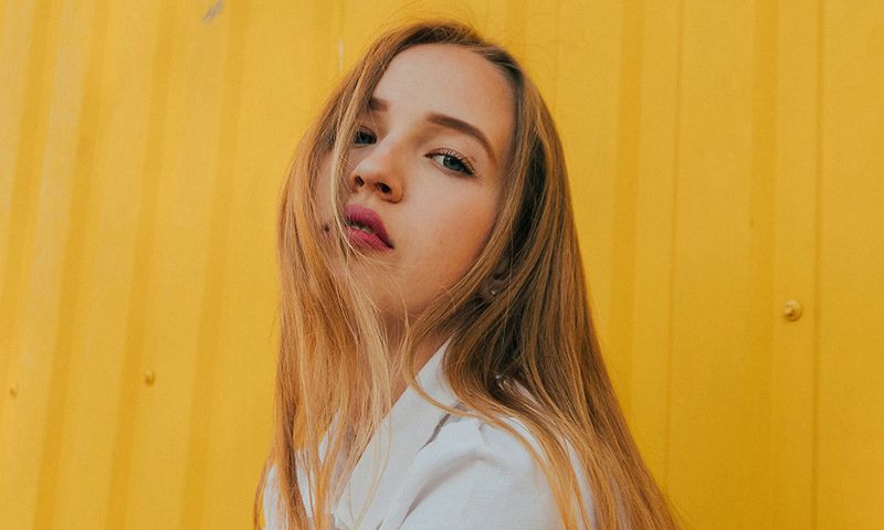 woman portrait against yellow background