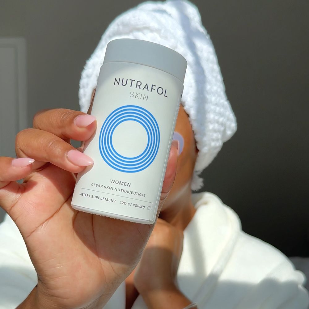 woman holding nutrafol skin neutraceutical 