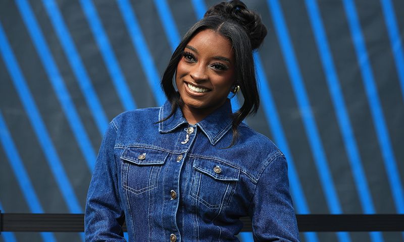 CHICAGO, ILLINOIS - SEPTEMBER 21: Gymnast Simone Biles looks on before the game between the Dallas Cowboys and the Chicago Bears at Soldier Field on September 21, 2025 in Chicago, Illinois.