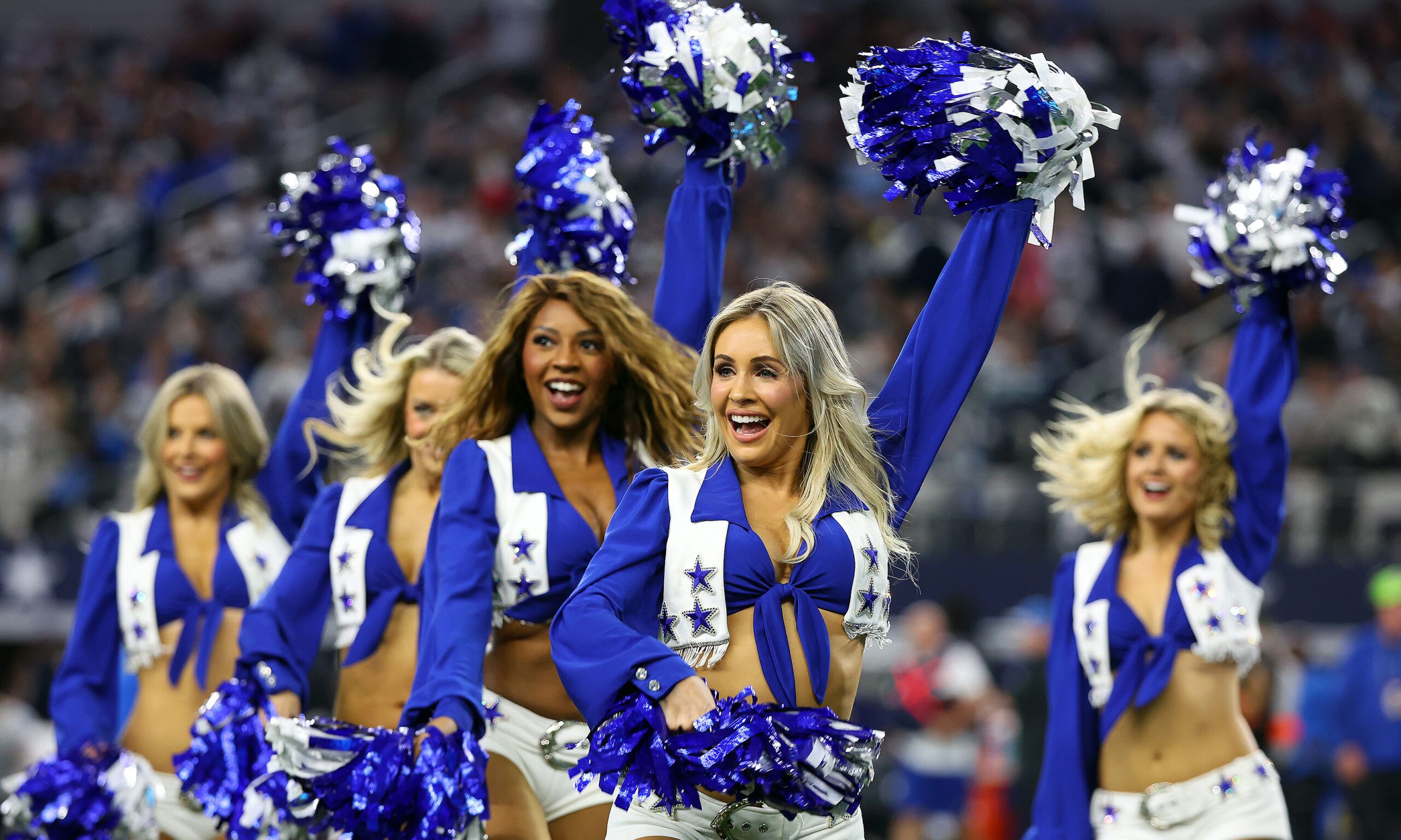 The Dallas Cowboys Cheerleaders perform during the game against the Detroit Lions at AT&amp;T Stadium on December 30, 2023 in Arlington, Texas.