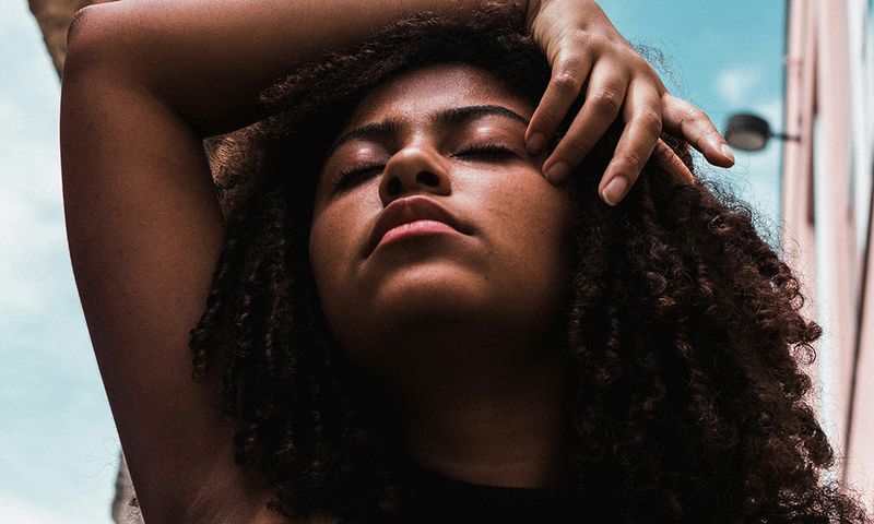 Black woman with natural curly hair