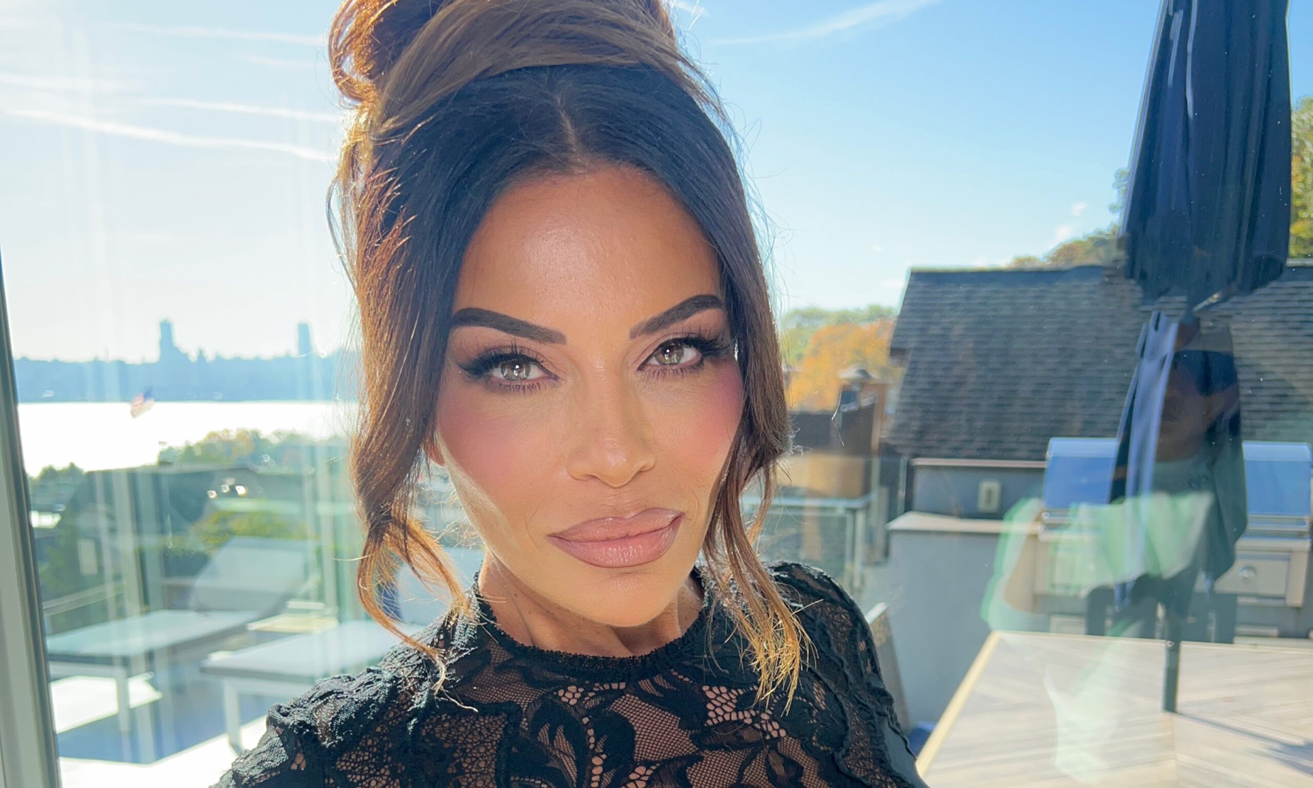 Dolores Catania posing in black dress