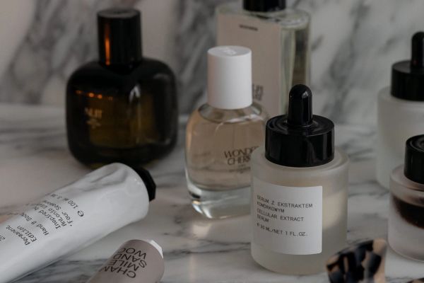 beauty products on marble vanity