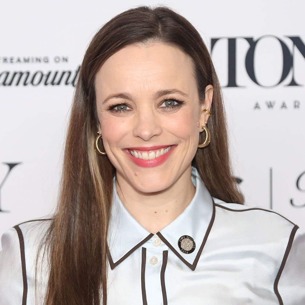 Rachel McAdams in a white and black blouse with brown long hair