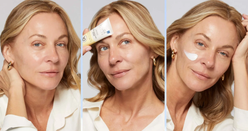 woman using laura geller beauty spackle primer SPF