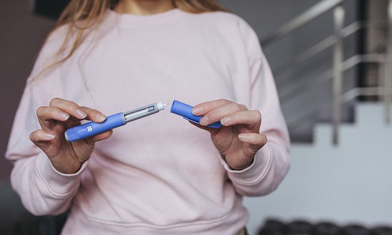 Semaglutide pen preparation for injection therapy captured in detail. The image depicts a medical device essential for individuals managing weight loss or type 2 diabetes.