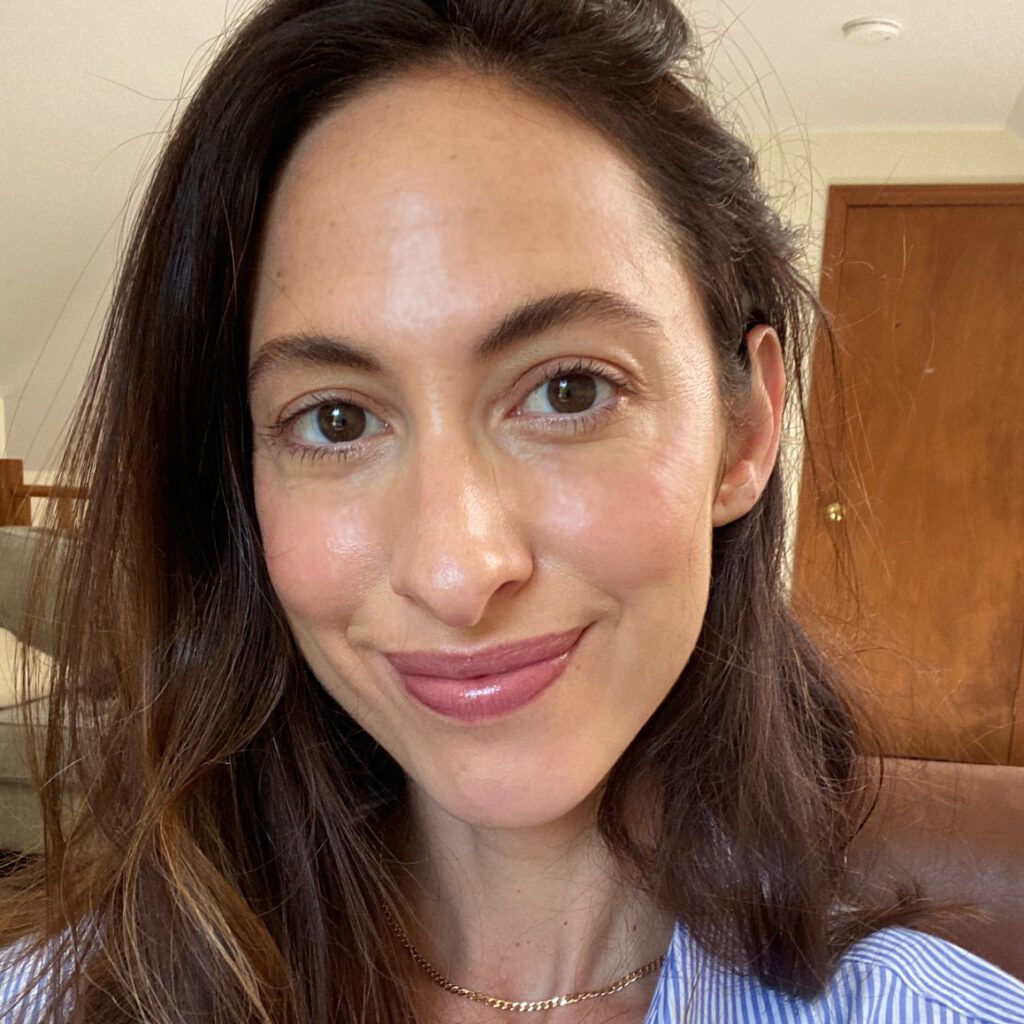 Portrait of woman wearing Clinique Black Honey makeup products