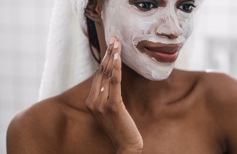 woman with clay mask on face