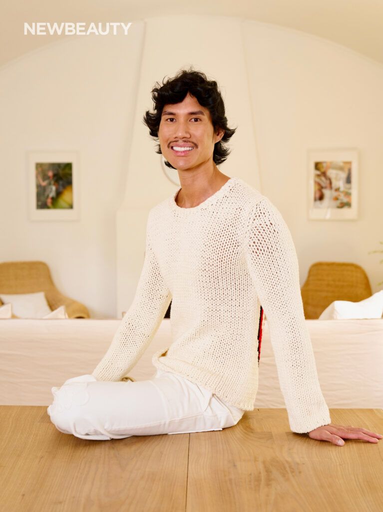 Patrick Ta in white sweater