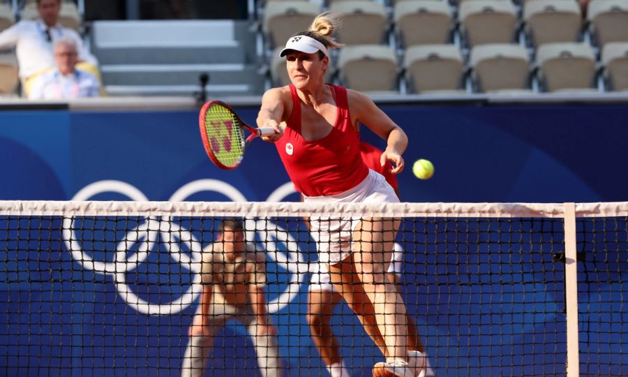 Gabriela Dabrowski of Team Canada plays a forehand as she plays with Felix Auger-Aliassime of Team Canada during the Tennis Mixed Doubles Bronze Medal match against Demi Schuurs and Wesley Koolhof of Team Netherlands on day seven of the Olympic Games Paris 2024 at Roland Garros on August 02, 2024 in Paris, France.