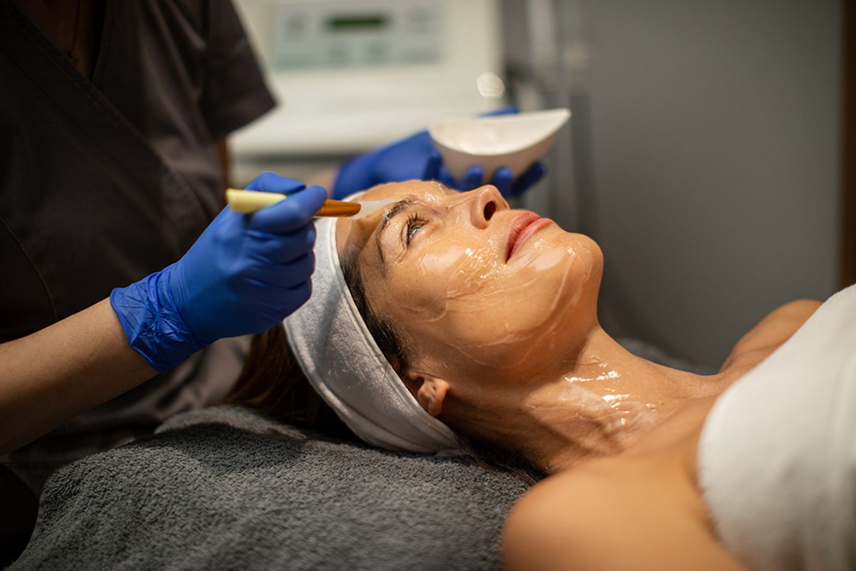 woman receiving in-office facial