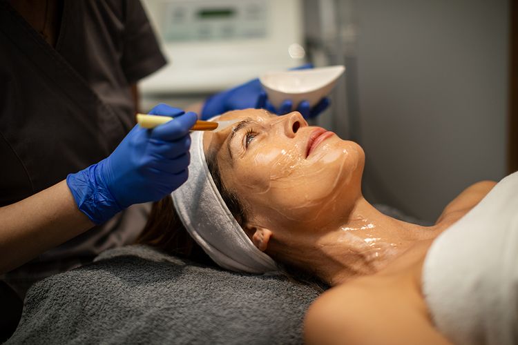 woman receiving in-office facial