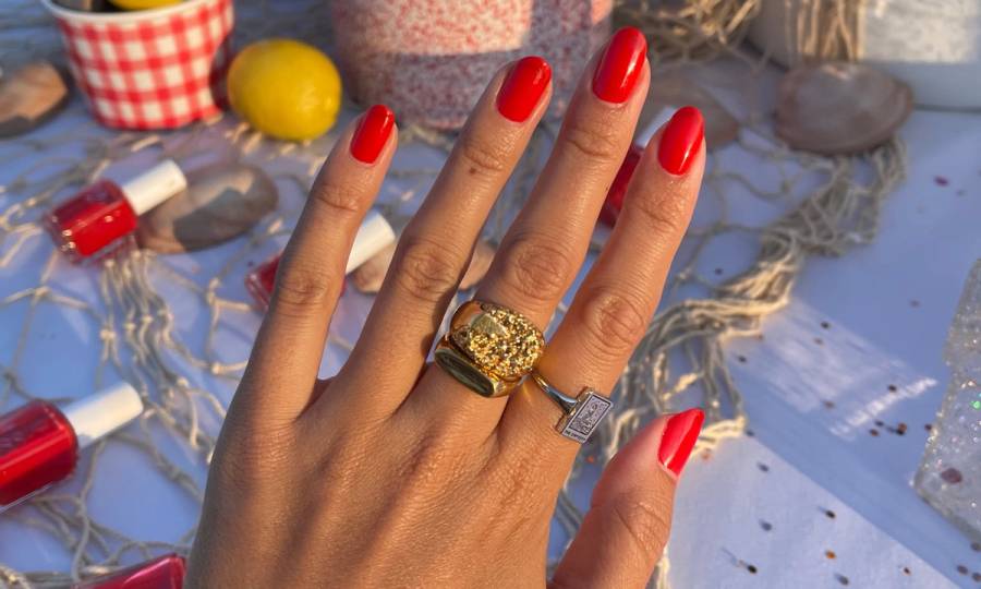 hand with nails painted in essie Clambake