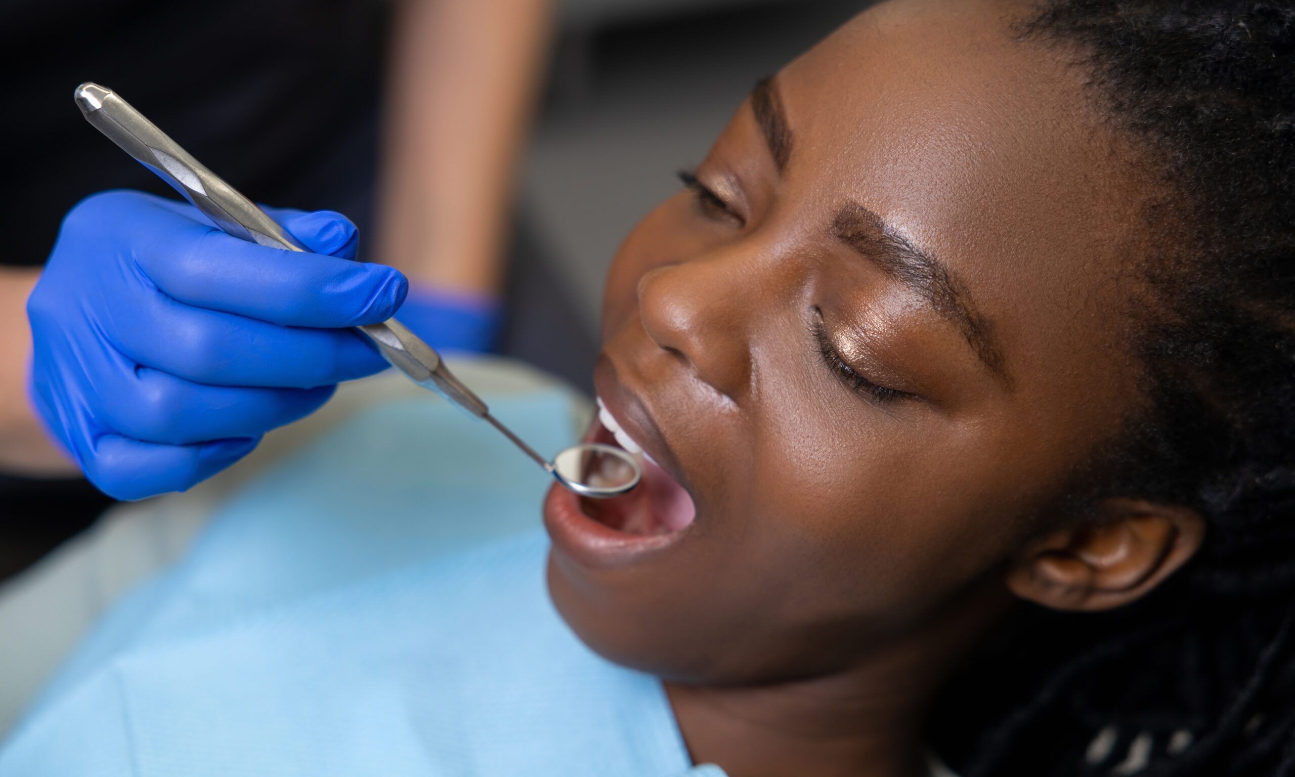 Woman patient receiving dental treatment in medical center