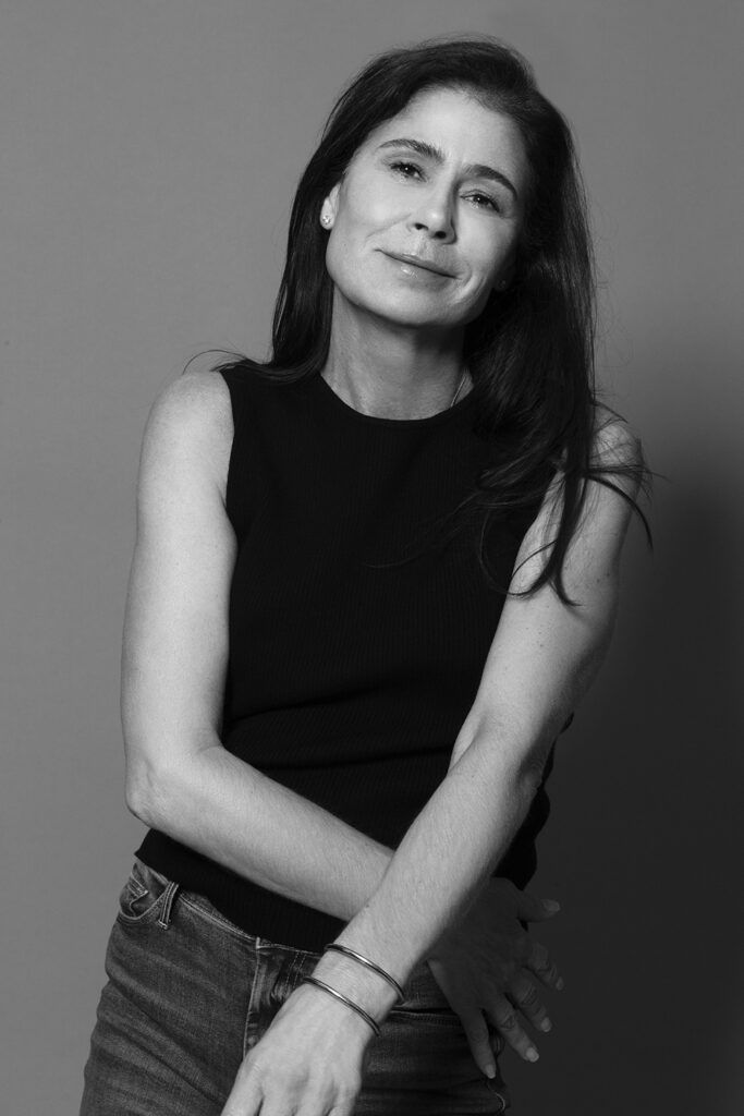 Maura Tierney standing black and white portrait