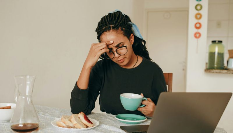 stressed woman thinking while eating