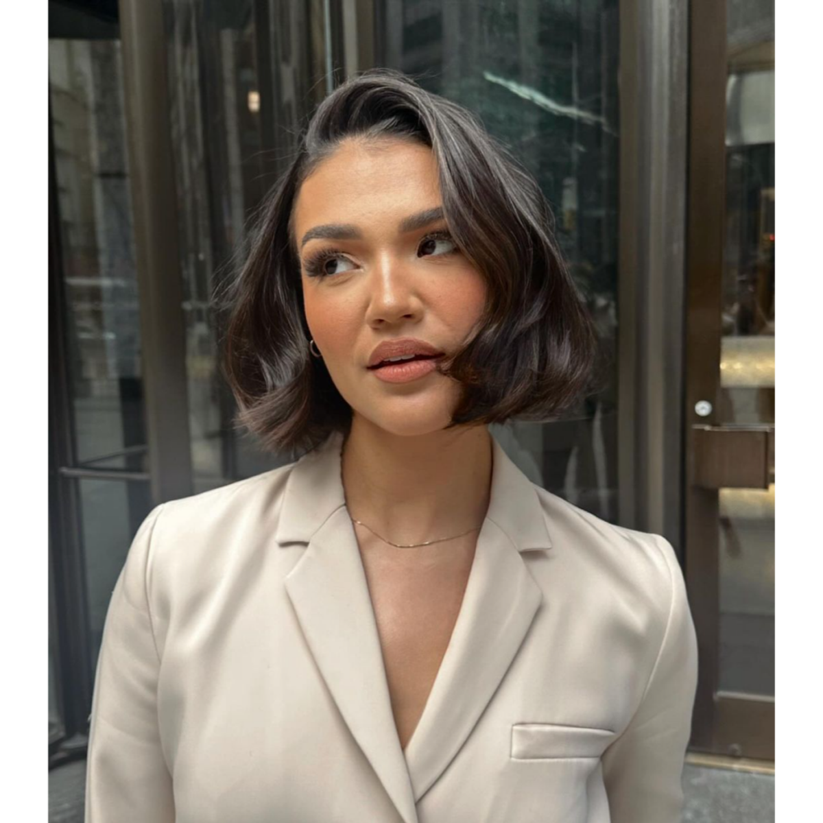 a model wearing a bob layered haircut