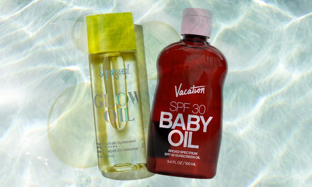 two sunscreen oil products on a background of water