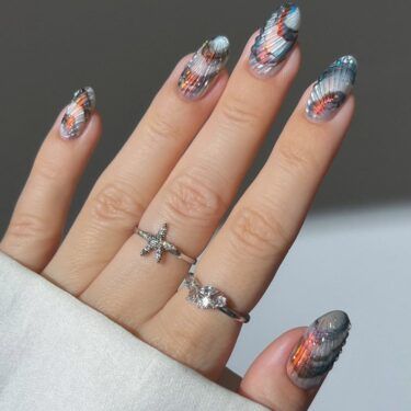 Manicure with textured design and holographic colors