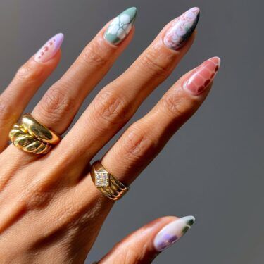 A manicure with mixed nail art designs