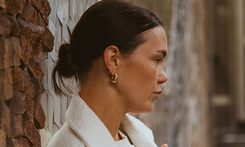 side profile of woman wearing earrings