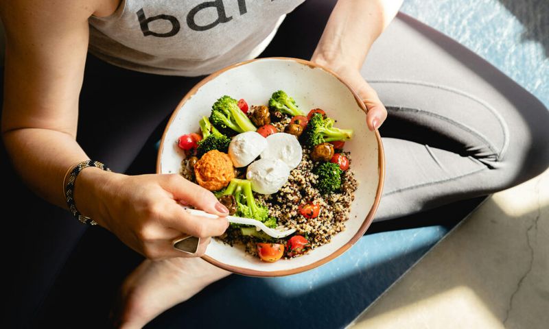 bowl of healthy food in woman's lap