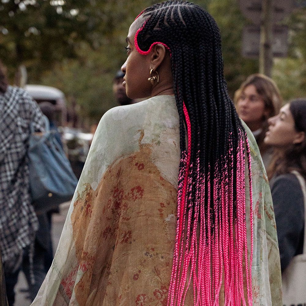 Back view of woman with dip-dyed pink cornrows