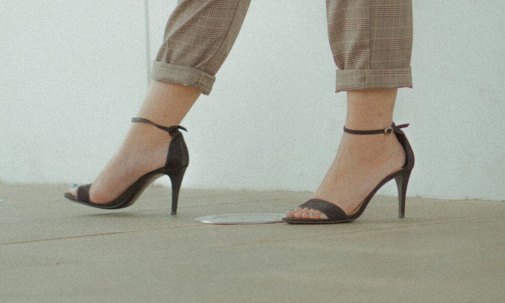 close up image of woman's feet in open-toed heels