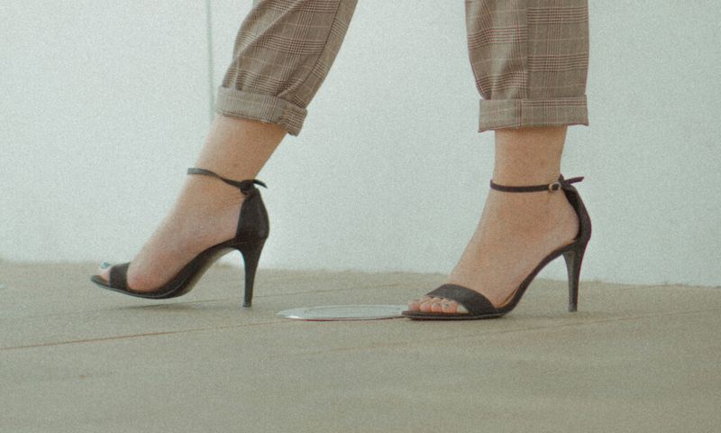 close up image of woman's feet in open-toed heels