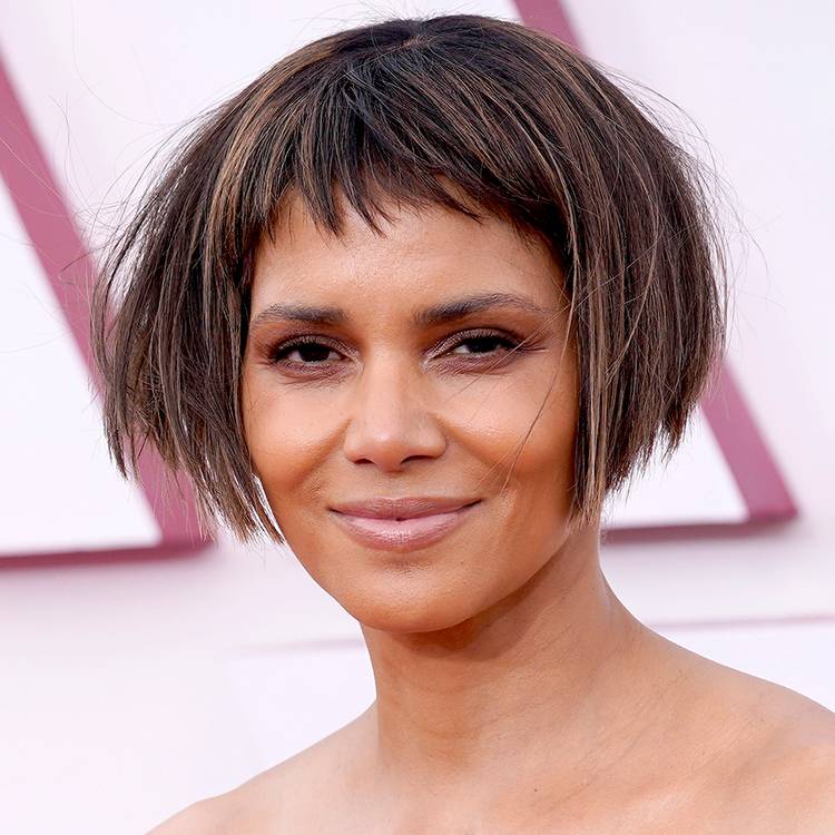 Close up of Halle Berry with a cheek-length bob and micro bangs