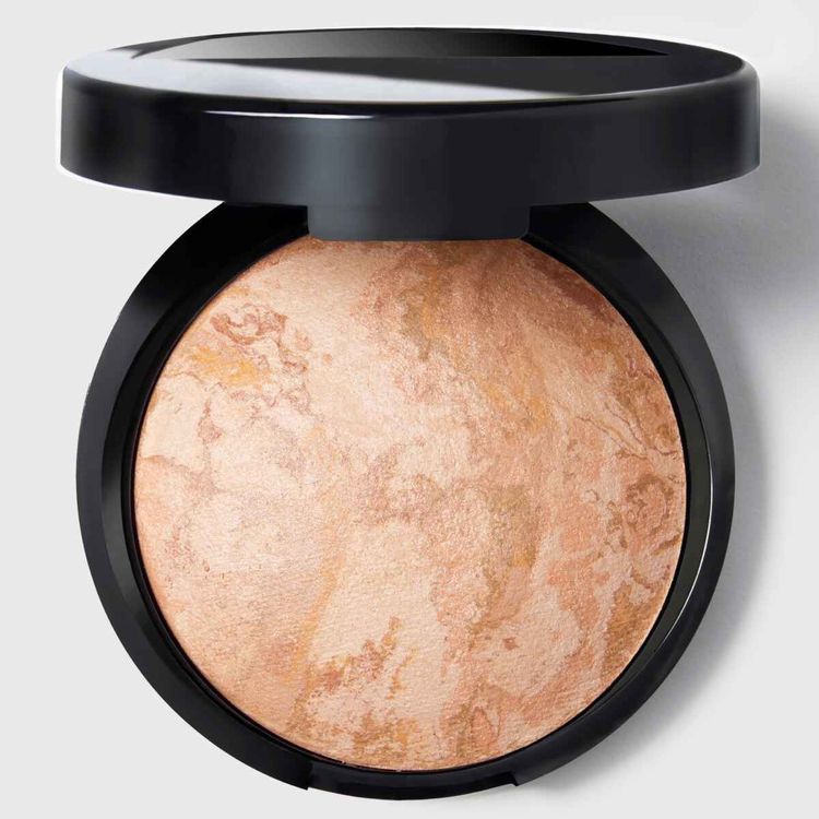 Laura Geller Baked Balance-n-Brighten Color Correcting Foundation in a compact, featuring marbled pigments for a natural, multidimensional finish.