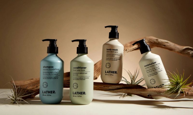 Lather body products on a nature-themed set up