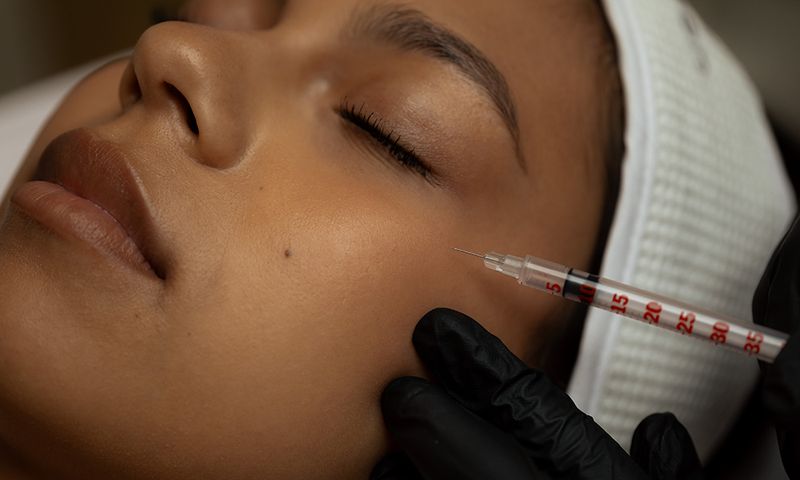 woman getting facial dfillers