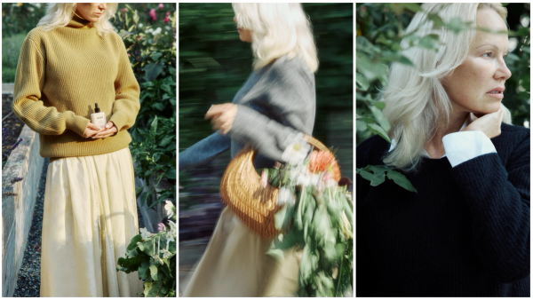 Pamela Anderson in a garden wearing a mustard sweater and holding Sonsie Skin skin care; walking with a flower-filled basket; close-up profile showing bare, natural skin.