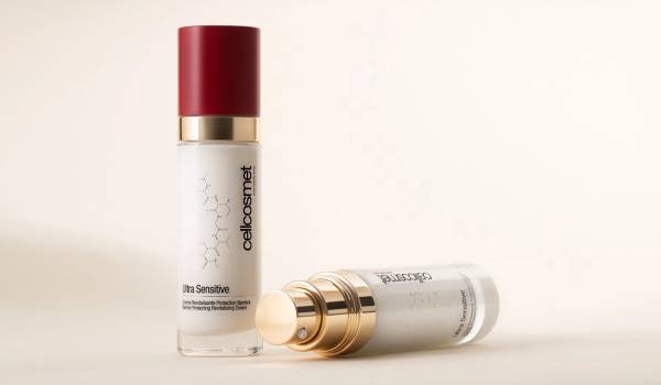 Two bottles of Cellcosmet Ultra Sensitive Barrier Protecting Revitalising Cream on a cream background