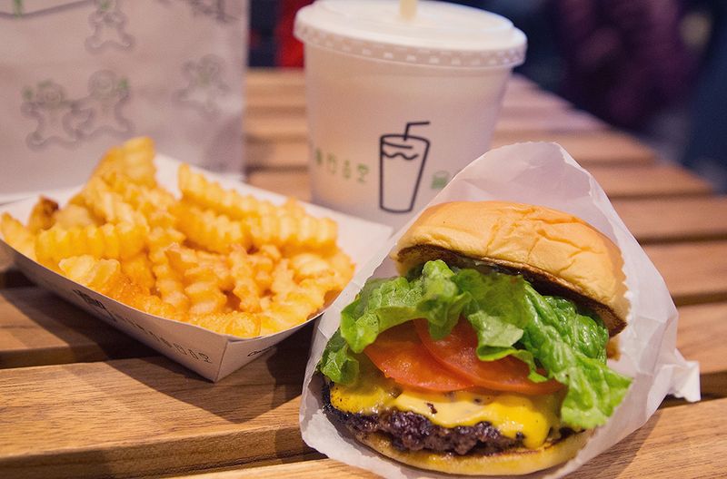 CHICAGO, IL - JANUARY 28: In this photo illustration a cheeseburger and french fries are served up at a Shake Shack restaurant on January 28, 2015 in Chicago, Illinois. The burger chain, with currently has 63 locations, is expected to go public this week with an IPO priced between $17 to $19 a share. The company will trade on the New York Stock Exchange under the ticker symbol SHAK. (Photo Illustration by Scott Olson/Getty Images)